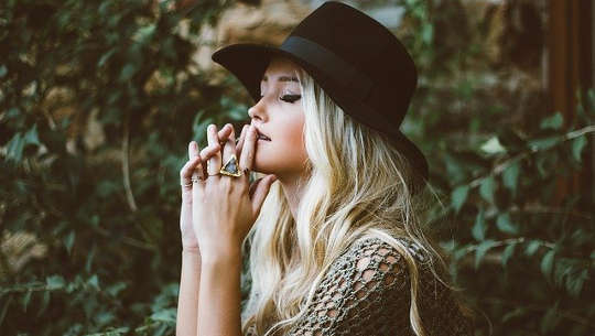 Putting A New Spin On Our Thoughts and Experiences girl wearing a hat deep in thought