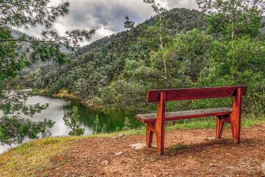 Life's Most Powerful Things: Mind and No Mind an unoccupied bench overlooking a river in a valley