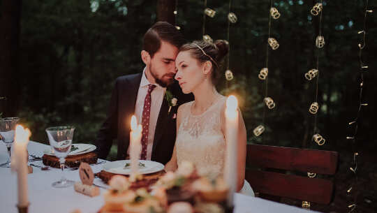 From Cheesy Relationships to a Gourmet Banquet couple sitting at a gourmet dining table