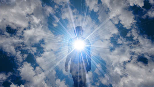 Being A Light unto this World: Healing the World by Being Present person radiating love and light from their heart out into the universe