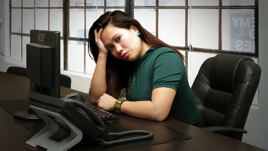 My Prescription for Anxiety and Worry woman sitting at her desk looking worried