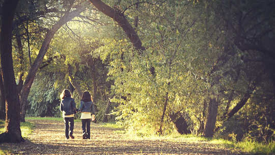 The Roads Both Taken two girls walking on a path