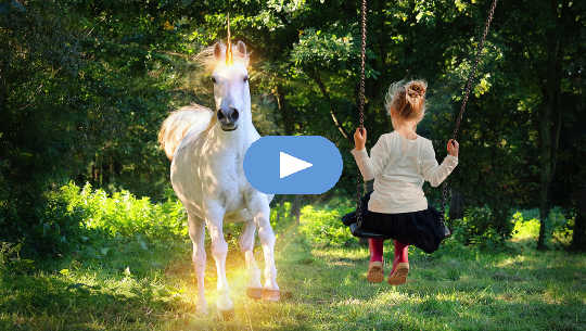 You Can Reawaken Your Potential and Participate in Planetary Rebirth young girl on a swing looking at a unicorn