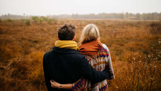 How The Pandemic Has Changed Dating, Sex, And Love couple out in nature with their arms around each other's waists