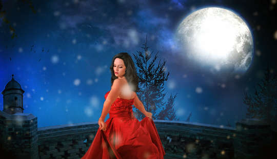 Empowering Your Life Under The Light of the Full Moon woman in a red dress under the light of the full moon
