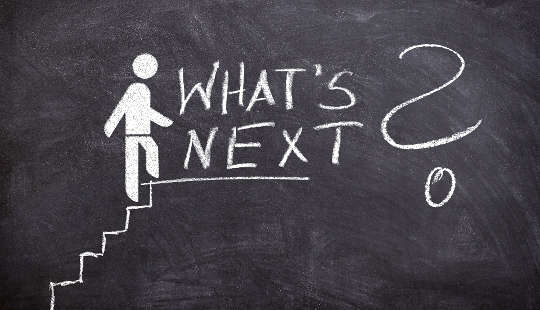 The Accumulation-Happiness Myth Is Fueled by False Beliefs a stick figure climbing the stairs to success and finding the words "What's Next?"