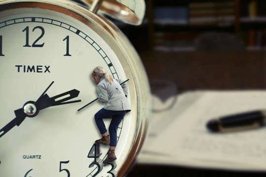 How to Make the Most Out of Every Minute a woman climbing on a clock