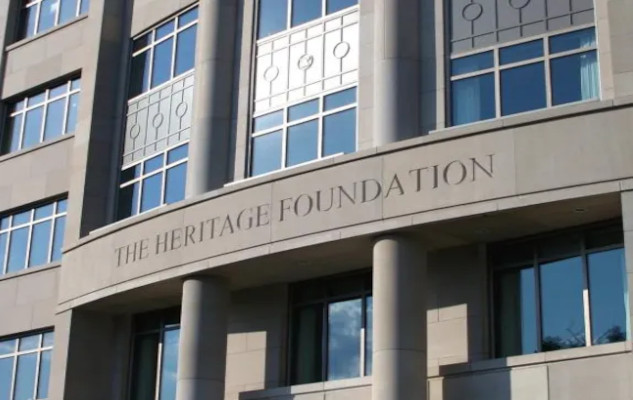 The Hidden Influence of the Heritage Foundation A depiction of the Heritage Foundation’s influence on U.S. governance showing how its policy blueprints have eroded democracy and concentrated power among elites.