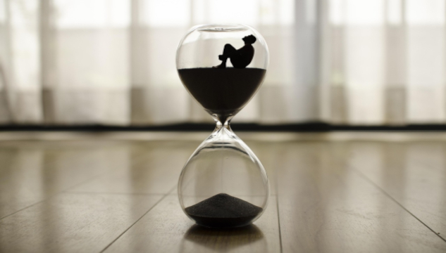 Always and Never: Powerful Words to Use or Not Use Person sitting in the top of an hourglass with the sanding falling through to the bottom. Image by xaviandrew from Pixabay.
