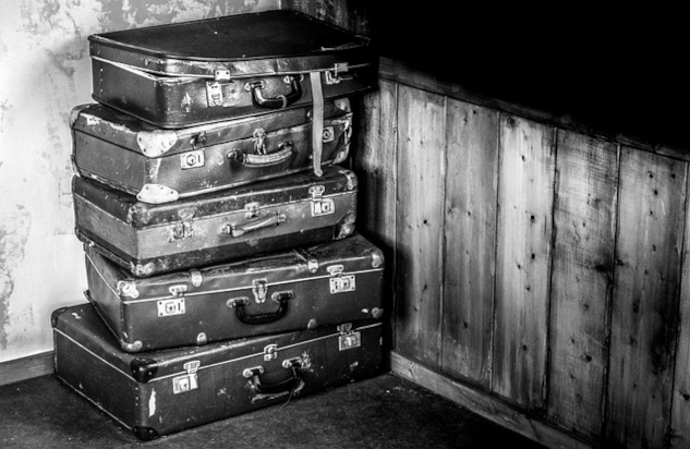 How to Let Go of Relationship Baggage A stack of old suitcases. Image by Rudy and Peter Skitterians from Pixabay.